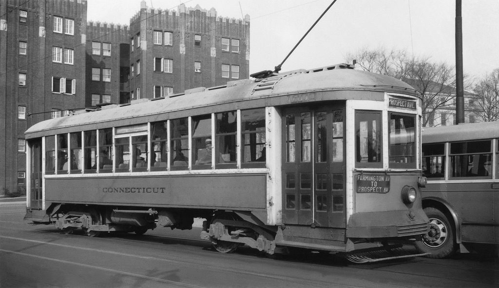 Connecticut Company Street Car seen at Farmington Avenue & Broad Street in downtown Hartford, March 16, 1935. Behind the streetcar sits the city bus, the doom of the trolley.