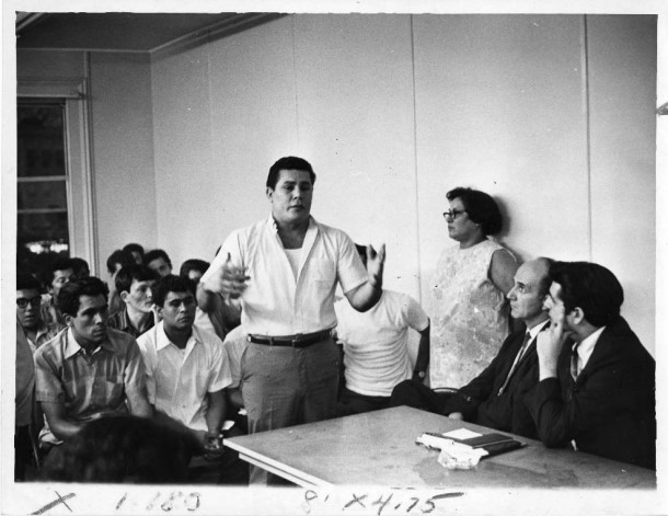 Puerto Rican Peter Castillo speaks at a meeting on August 15, 1969 with Hartford city officials. Others are Councilman Nicholas Carbone, at far right; city Manager Elisha C. Freedman; and Mrs. Maria Sanchez. CREDIT JUAN FUENTES/HARTFORD TIMES / HARTFORD HISTORY CENTER, HARTFORD PUBLIC LIBRARY